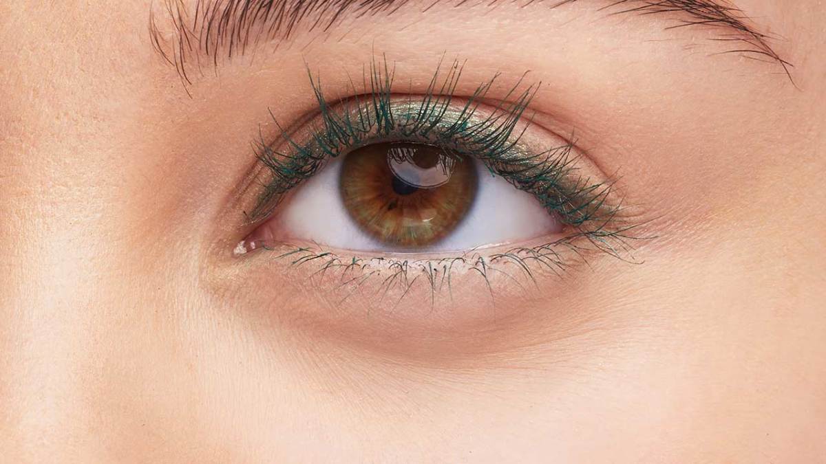 Hazel eyes with green mascara.